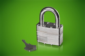 Simple lock and key. Small worn padlock with shiny key. Business data encryption, home security, or...