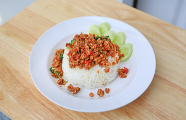 Rice topped with Minced pork and basil leaf. Thai food.