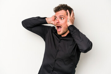 Young caucasian man isolated on white background screaming, very excited, passionate, satisfied with something.