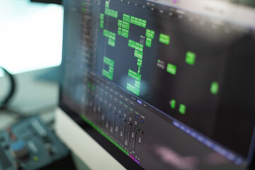 Computer screen showing chunks of midi programmed music on a digital audio workstation at a...