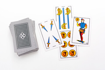 Spanish card game, spanish deck Tarot cards, the wands, cups, gold (coins) and swords card in the...