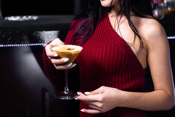Woman drinks cocktail