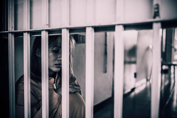Portrait of women desperate to catch the iron prison,prisoner concept,thailand people,Hope to be...