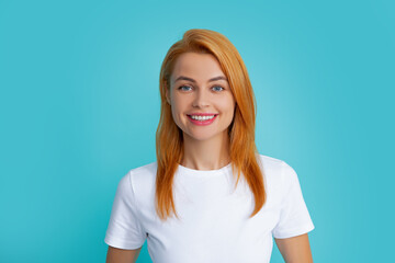 Obraz premium Happy smiling woman portrait. Attractive young pretty cheerful girl in casual clothing feeling happy and carefree, isolated background. Happiness woman face.