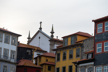Fototapeta na wymiar Facades of houses with tiles in the city of Porto in the summer of 2022.