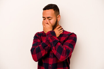 Young hispanic man isolated on white background suffers pain in throat due a virus or infection.