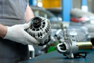 Repair and maintenance in a car service. An auto mechanic inspects the technical condition of a new...