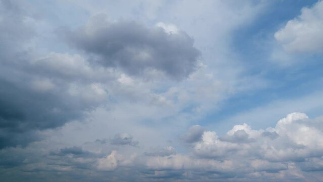 Clear blue sky with some white fluffy clouds. Natural heaven backdrop.