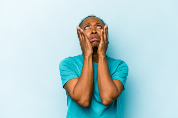 Young african american woman isolated on blue background whining and crying disconsolately.