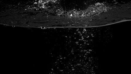 Water bubbles floating on black background which represent refreshing of refreshment from soda or...