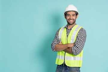 Portrait of young professional heavy industry engineer or worker isolated on green background - obrazy, fototapety, plakaty