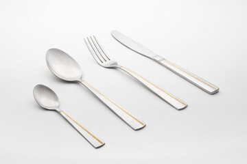 elegant metal cutlery set isolated on white
