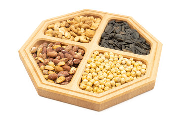 Peanuts cashew sunflower seeds and chickpea in the wooden bowl above white background