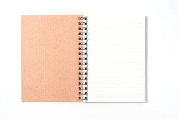 Brown spiral notebook isolated on white background.top view