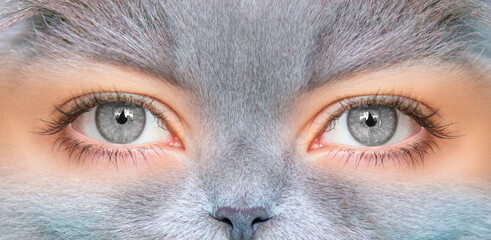 A young girl with beautiful gray eyes with a gray cat face