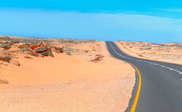Empty curve asphalt road - Namib desert, Africa 
