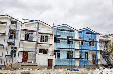 The progress of construction of the kindergarten building. Modern decoration of building facades