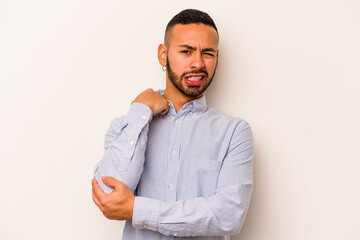 Young hispanic man isolated on white background massaging elbow, suffering after a bad movement.