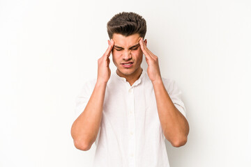 Young caucasian man isolated on white background having a head ache, touching front of the face.