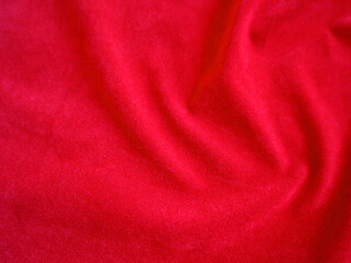 Red velvet fabric texture used as background. Empty red fabric background of soft and smooth textile material. There is space for text.
