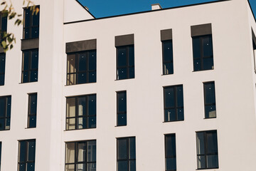 Fragments of facades of modern residential buildings, side view, close-up.