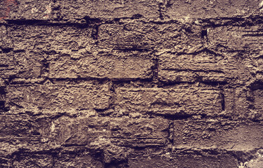 Brick brown Wall. Rock pile. Rock background. Rock texture. Stone background. Paint spots. Rock surface with cracks. Grunge Rough structure. Abstract texture.