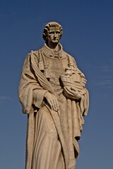 Fototapeta na wymiar Statue of Sao Vicente on the Largo das Portas so Sol square in Lisbon