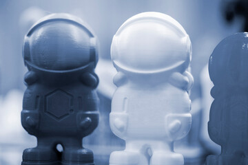 Objects printed on 3d printer made of white plastic close-up. Models created on 3D printer from filament. Modern new prototyping technology. Additive automation manufacturing Fused deposition modeling