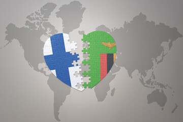puzzle heart with the national flag of zambia and finland on a world map background. Concept.