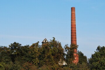brick chimney and building - roof part behind the door