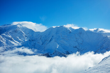View above clouds of Alps mountains and Mont Blanc massif