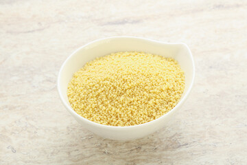 Raw couscous in the bowl