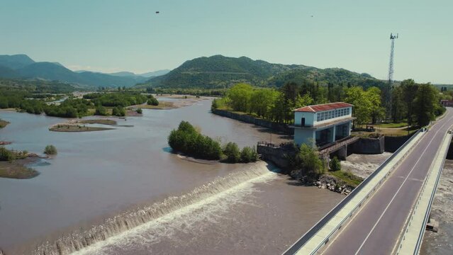 drone shot of a wide river and a bridge on it. High quality 4k footage