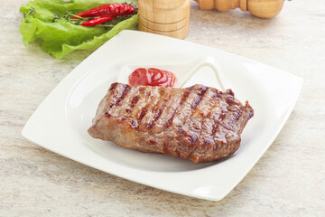 Grilled rib-eye steak beef meat