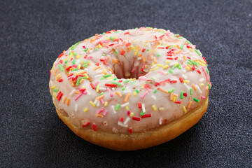 Sweet glazed vanilla donut with icing