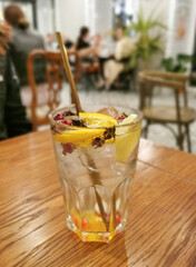 Lemonade with lemon and star anise in a glass.