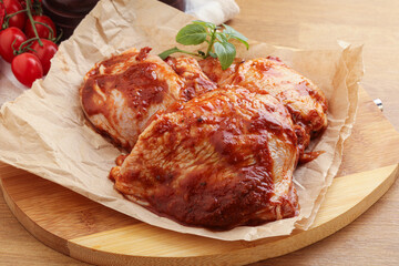 Marinated chicken leg in tomato sauce