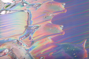 Abstract cosmetics gel on holographic background.Good as cosmetic banner.