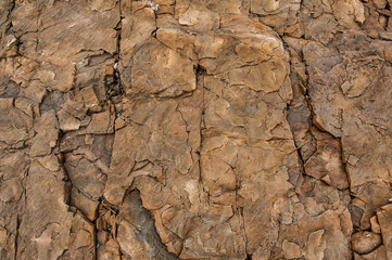 Natural background of red stone texture. Surface of the mountain