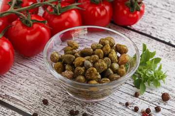 Marinated green capers in the bowl