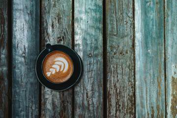 Latte coffee in white mug top view