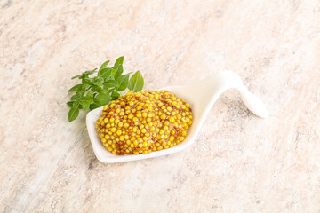 Grain mustard sauce in the bowl