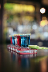 tequila and apple slice in shot glasses