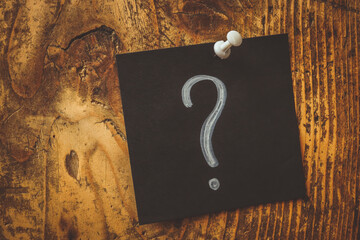 Pinned dark sticker and question mark on it.