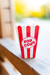 Classic red striped outdoor popcorn box. Going to the cinema.