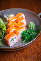Japanese rolls with red fish. serving in a cafe