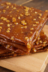 Turkish delights with plenty of hazelnut, pistachio and walnut on a wooden background