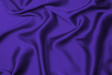 Purple silk or satin luxury fabric texture can use as abstract background.