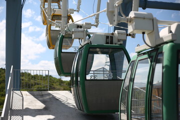 Ferris wheel. Amusement park with a big wheel for an overview of the city. Steel metal structure with cabins for people