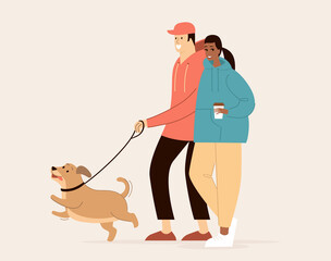 Young multiracial couple walking with a dog together